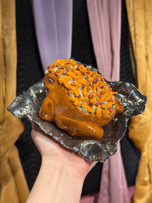 Spudley the Cheesy Bacon Potatoad Served on a Golden “Foil” Dish