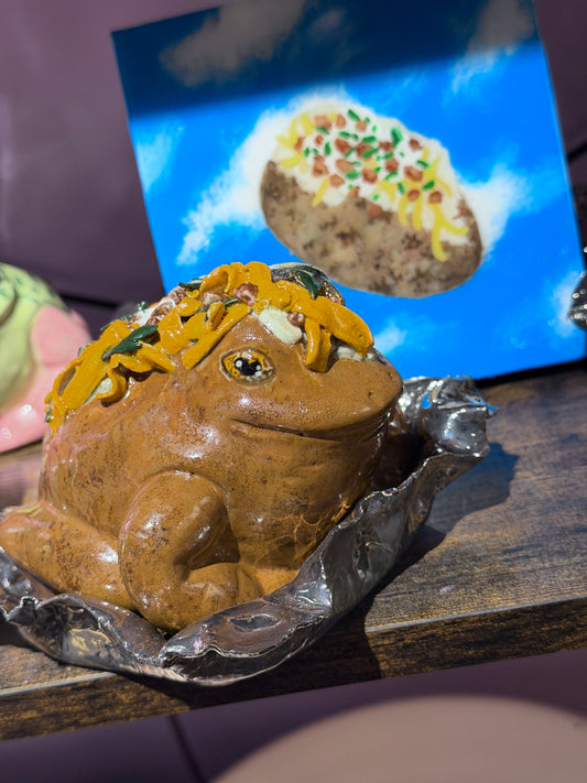 Tate the OG Loaded Potatoad Served on a Golden “Foil” Dish