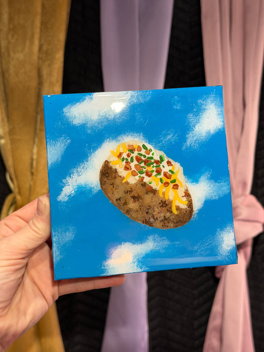 Tate the OG Loaded Potatoad Served on a Golden “Foil” Dish